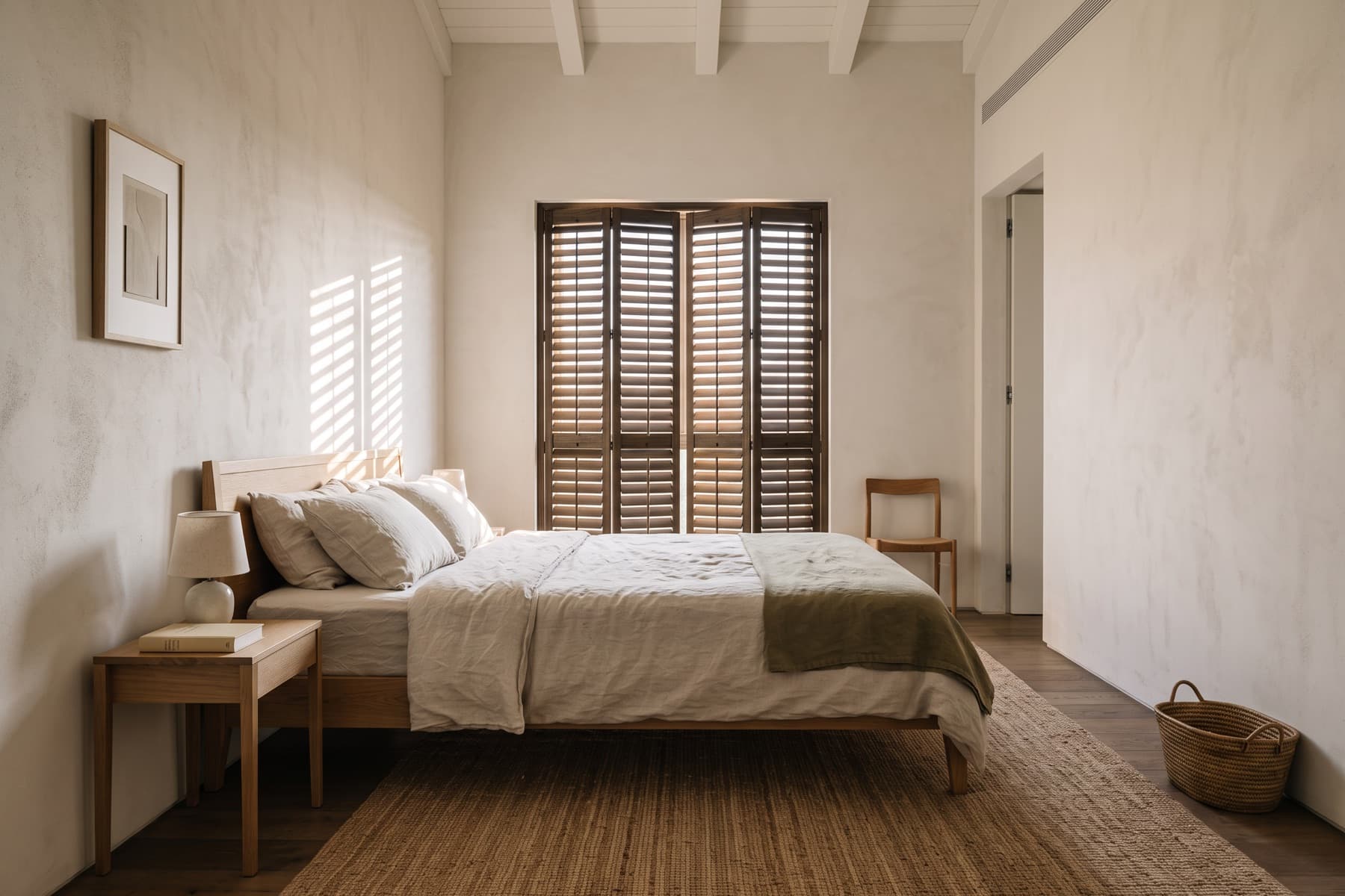 Neve Tzedek residence: guest bedroom with shuttered windows