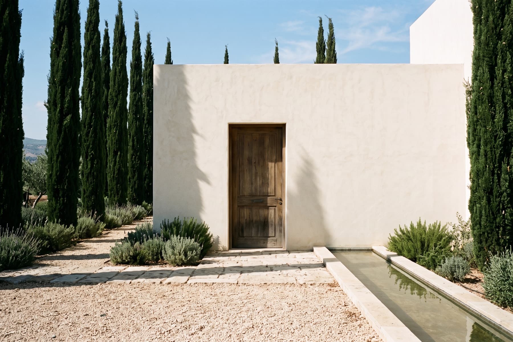 Caesarea hillside villa: entrance court framed by cypress