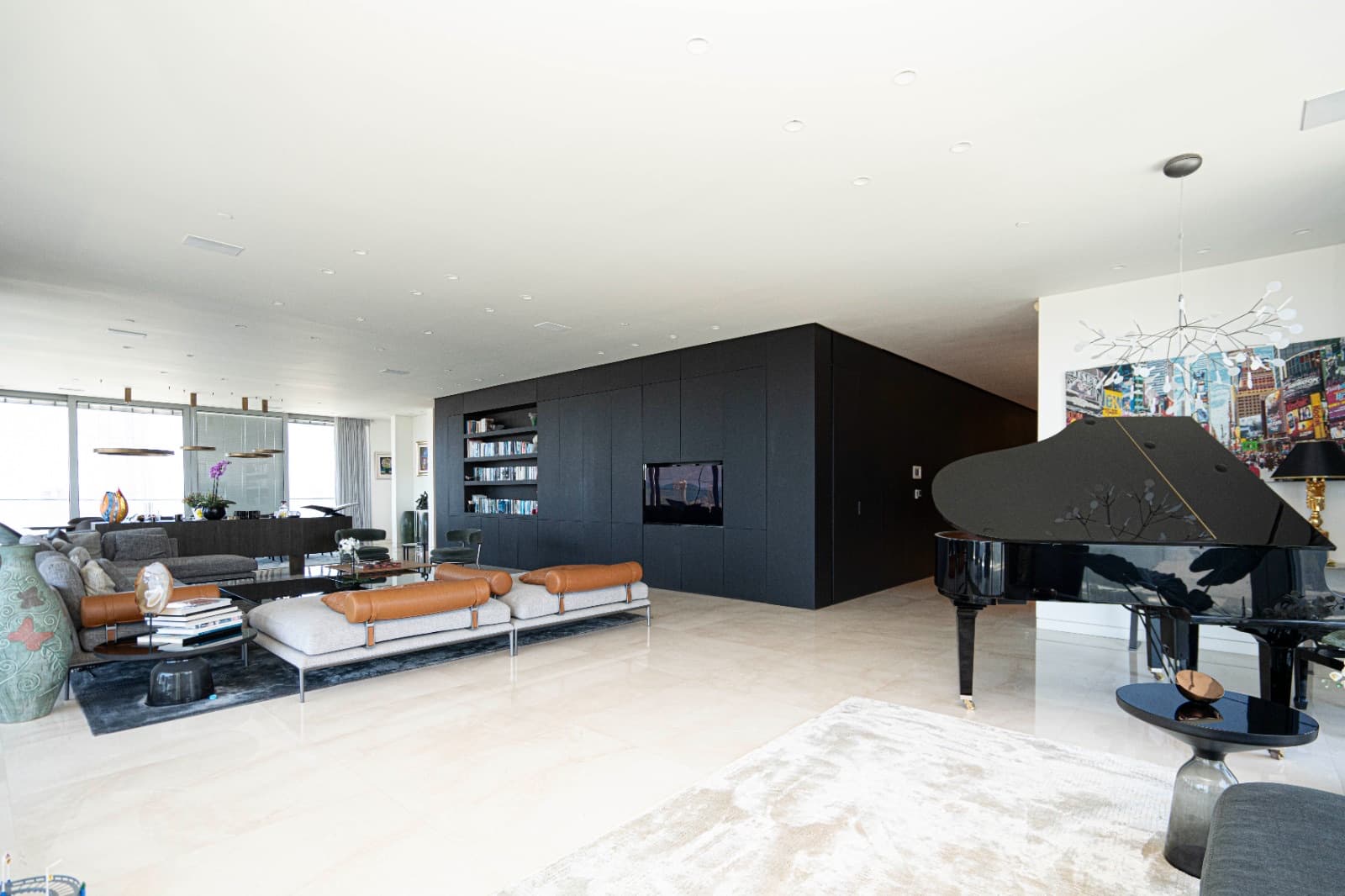 Grand piano and library wall in the main reception