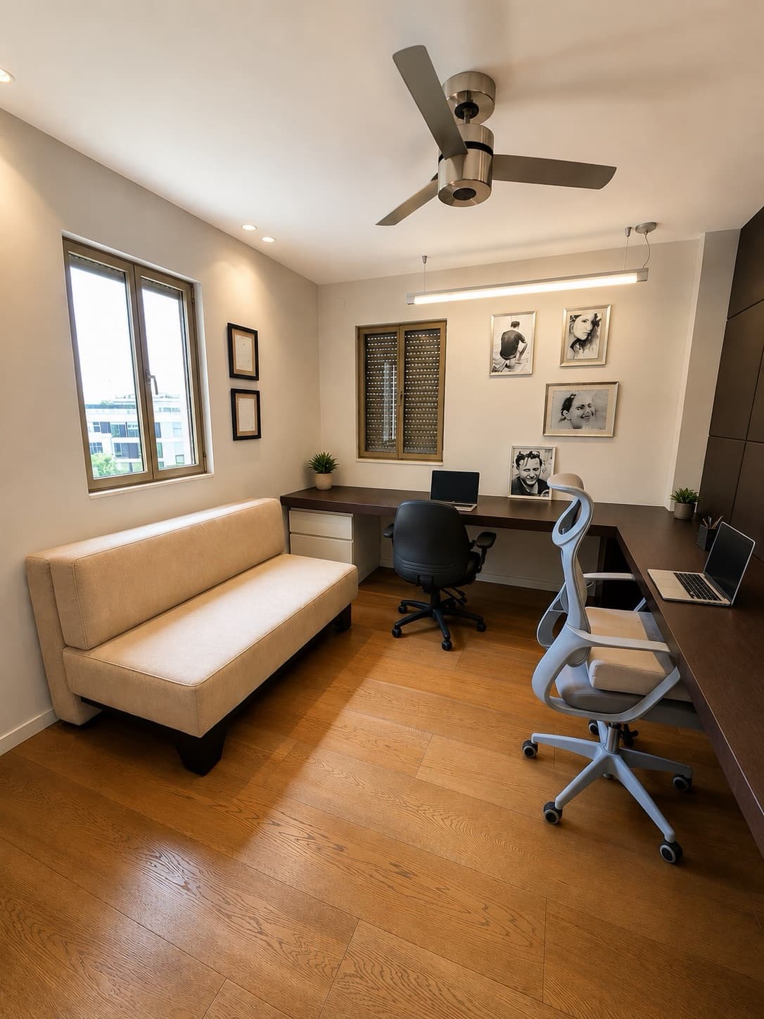Upper-level suite arranged as a double home office with sofa